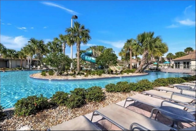 view of pool featuring a water slide