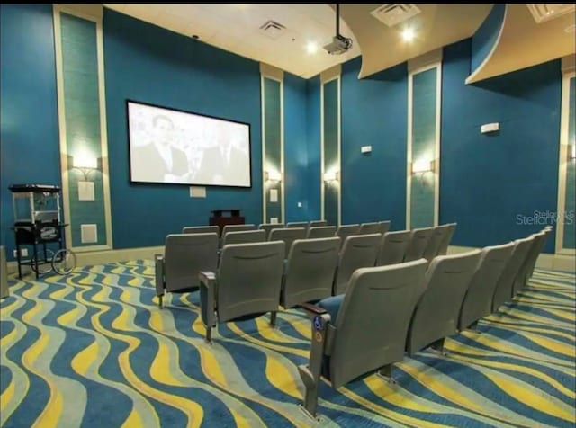 cinema room featuring carpet