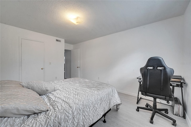 bedroom with a textured ceiling