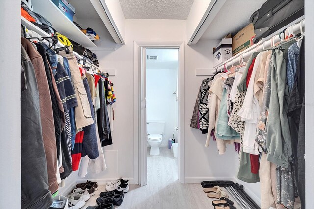 walk in closet featuring light wood-type flooring