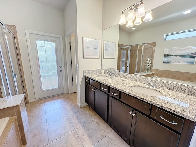 bathroom featuring tile patterned flooring, an inviting chandelier, an enclosed shower, and dual bowl vanity