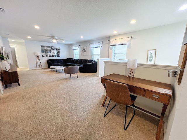 carpeted office with ceiling fan