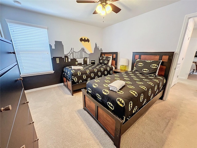 bedroom with light colored carpet and ceiling fan