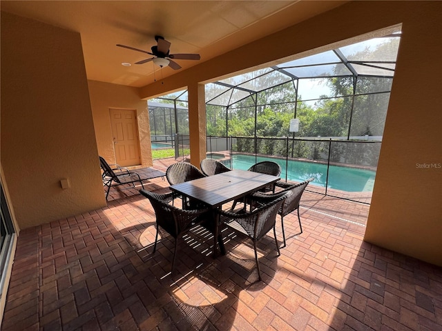 sunroom / solarium with a pool and ceiling fan