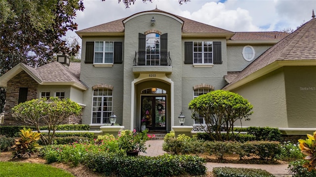 view of front of house with a balcony