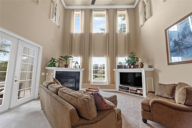 living room with light carpet and a towering ceiling