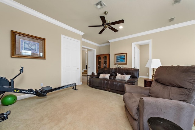 carpeted living room with ceiling fan and ornamental molding