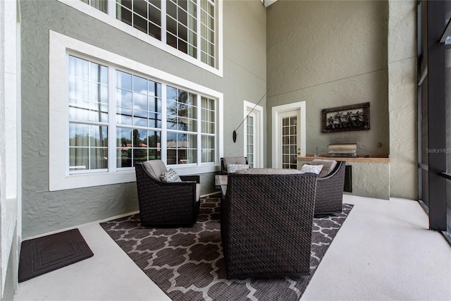 view of patio featuring outdoor lounge area and a grill