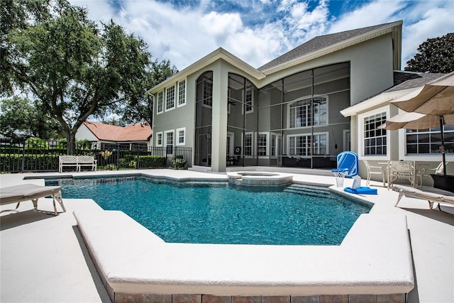 view of pool featuring an in ground hot tub and a patio