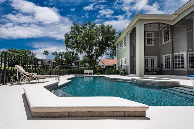 view of swimming pool featuring a patio, french doors, fence, and a pool with connected hot tub