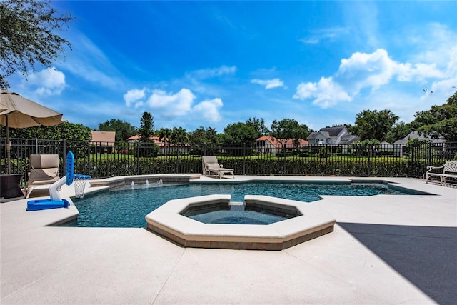 view of pool featuring an in ground hot tub, a patio, and pool water feature