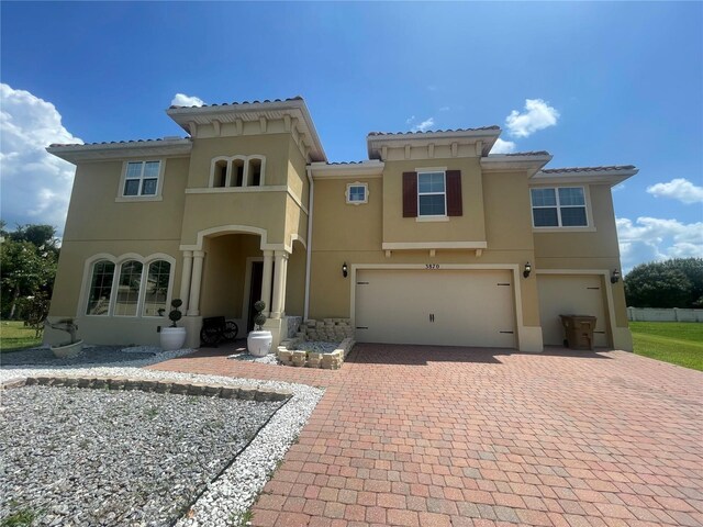 mediterranean / spanish-style house featuring a garage