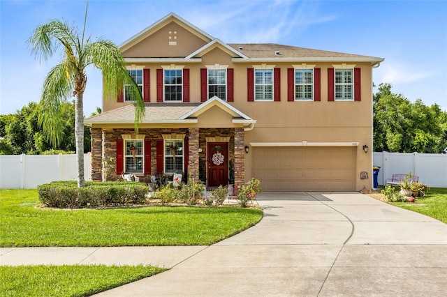 view of front of home featuring a front yard and a garage