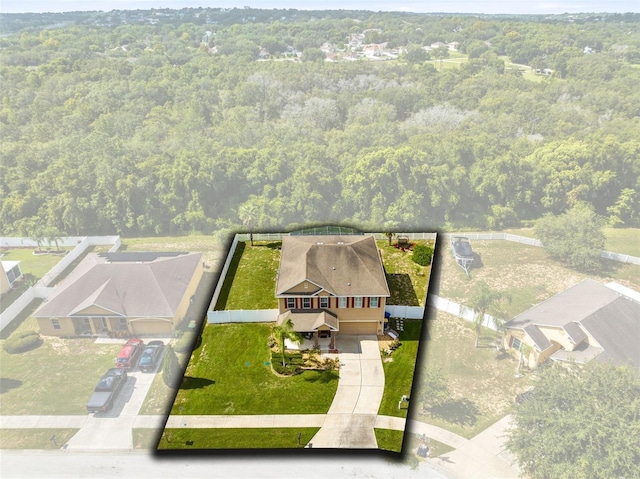 aerial view featuring a wooded view