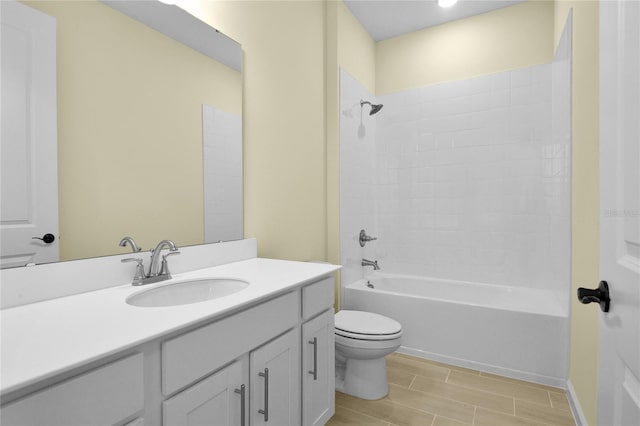 full bathroom featuring shower / tub combination, vanity, and toilet