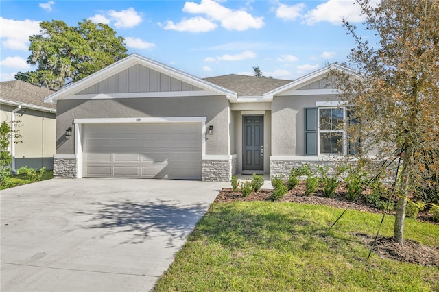 view of front of house with a front yard and a garage