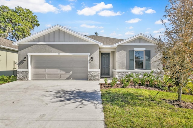 view of front facade with a front yard and a garage