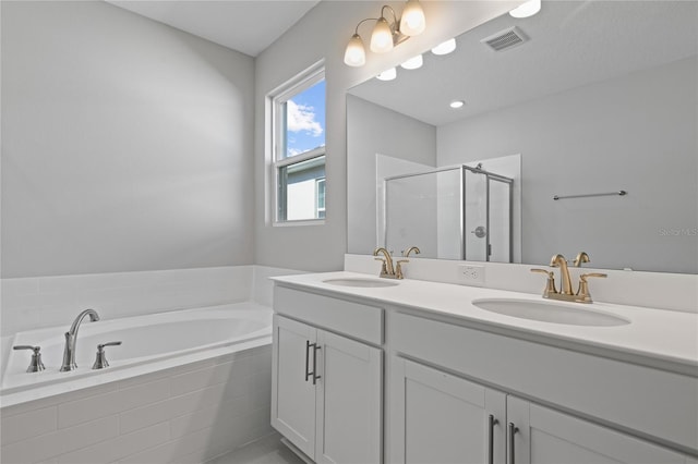 bathroom featuring vanity and plus walk in shower