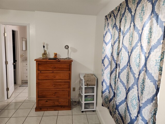 2518 Bowmer Dr, Kissimmee, FL 34744 - bedroom with light tile patterned floors and baseboards