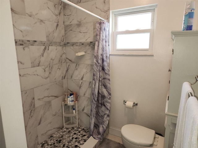 bathroom with toilet and walk in shower