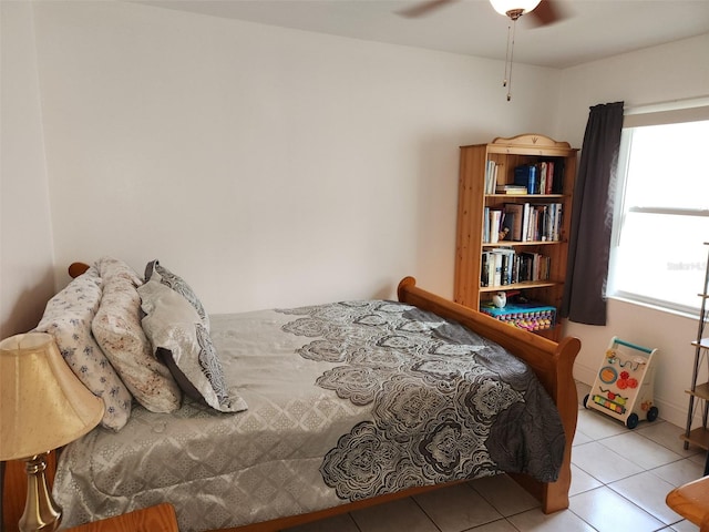 bedroom featuring light tile patterned flooring and ceiling fan