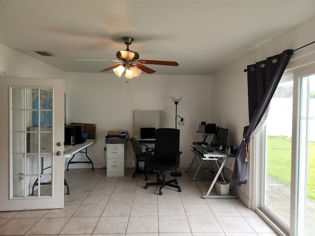 office space featuring light tile patterned floors and ceiling fan