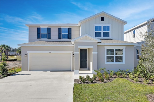 view of front facade with a garage and a front lawn