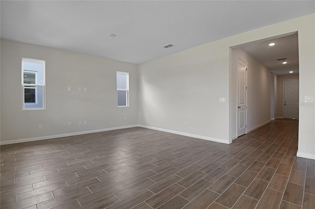 empty room featuring dark hardwood / wood-style floors