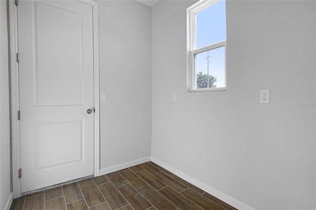 empty room featuring dark hardwood / wood-style flooring