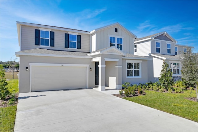 view of front facade featuring a garage and a front yard