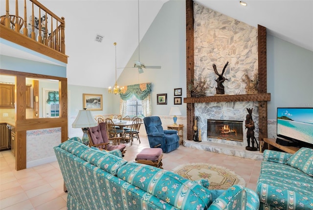 tiled living room featuring high vaulted ceiling, ceiling fan with notable chandelier, and a stone fireplace