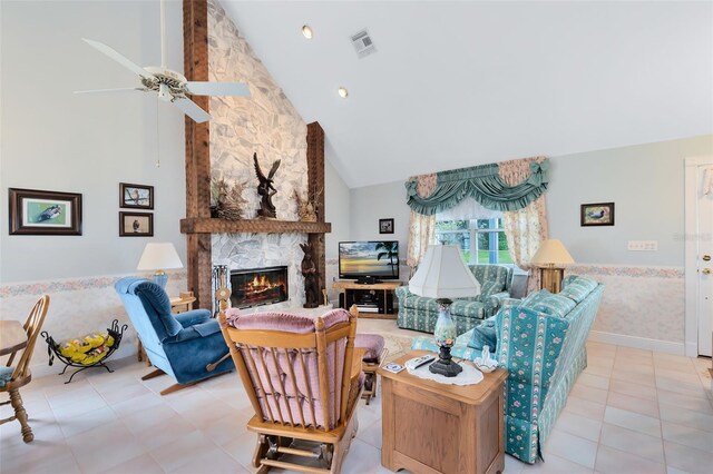 living room featuring ceiling fan, high vaulted ceiling, light tile patterned floors, and a fireplace