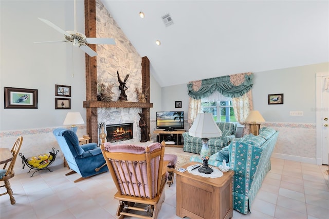 living room with a fireplace, high vaulted ceiling, and ceiling fan