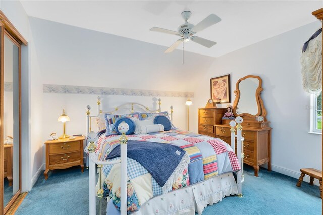 bedroom with vaulted ceiling, carpet, and ceiling fan