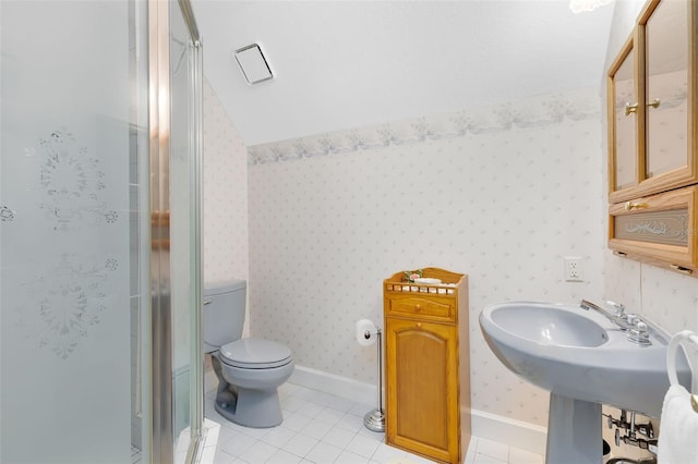 bathroom with an enclosed shower, vaulted ceiling, tile patterned floors, and toilet