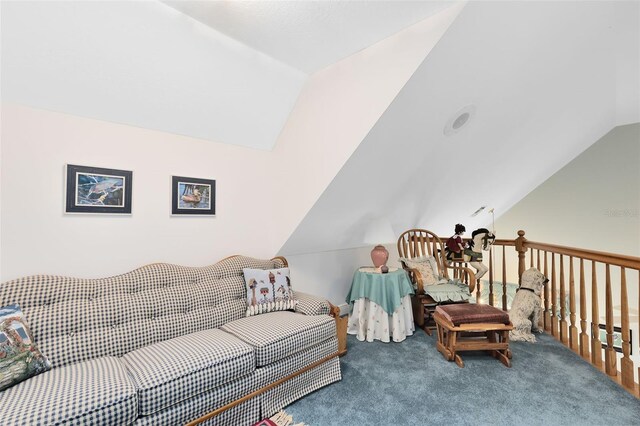 carpeted living room with lofted ceiling