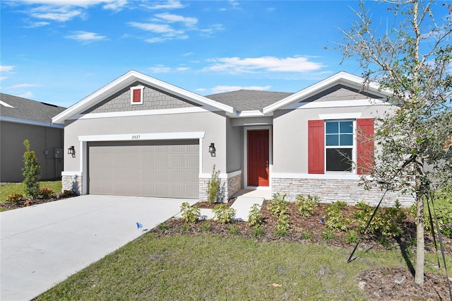 view of front of property featuring a garage and a front yard