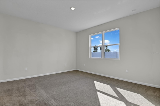 unfurnished room featuring carpet flooring