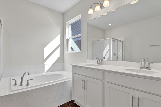 bathroom featuring vanity, hardwood / wood-style floors, and shower with separate bathtub