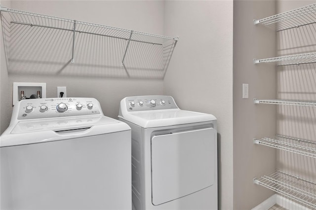 laundry area with separate washer and dryer