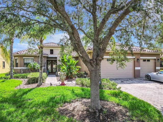 mediterranean / spanish-style home featuring a garage