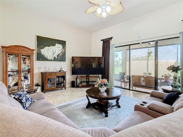 living room with ceiling fan and light tile patterned floors