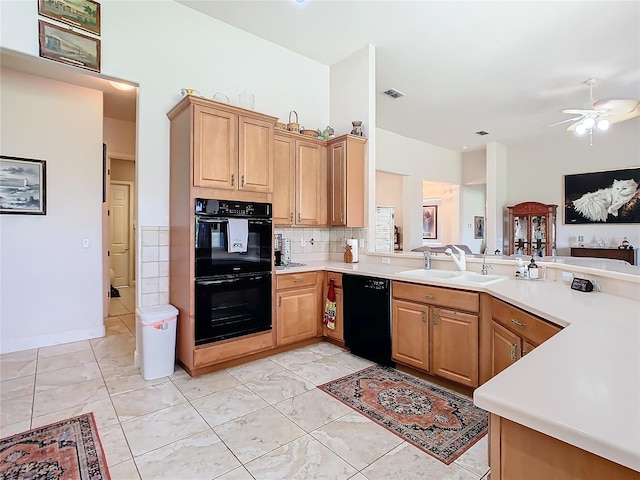 kitchen featuring black appliances, sink, kitchen peninsula, and ceiling fan