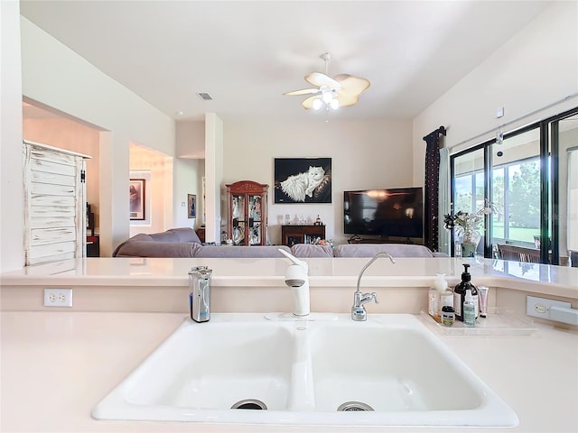 kitchen featuring sink and ceiling fan