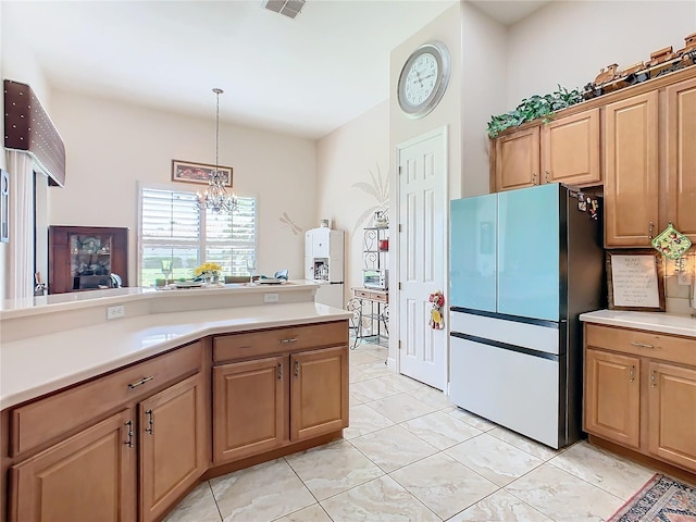 kitchen with stainless steel fridge, light tile patterned flooring, a chandelier, and decorative light fixtures