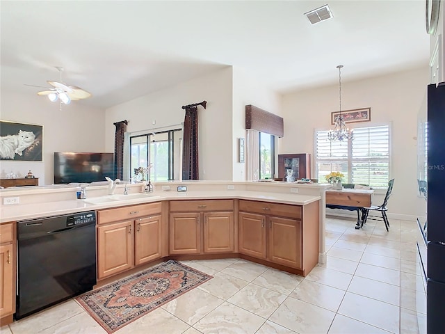 kitchen with light tile patterned floors, a wealth of natural light, and black dishwasher