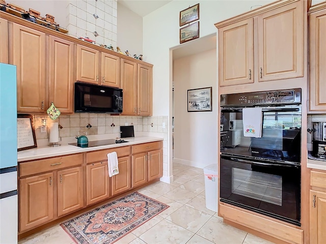 kitchen with black appliances, light tile patterned flooring, light brown cabinetry, and decorative backsplash