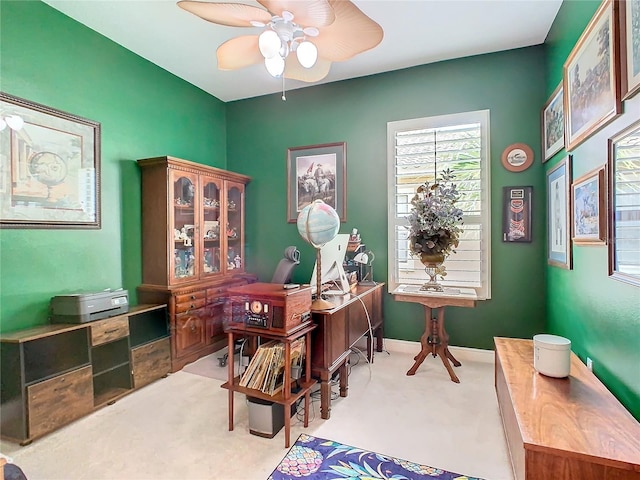 home office featuring ceiling fan and carpet