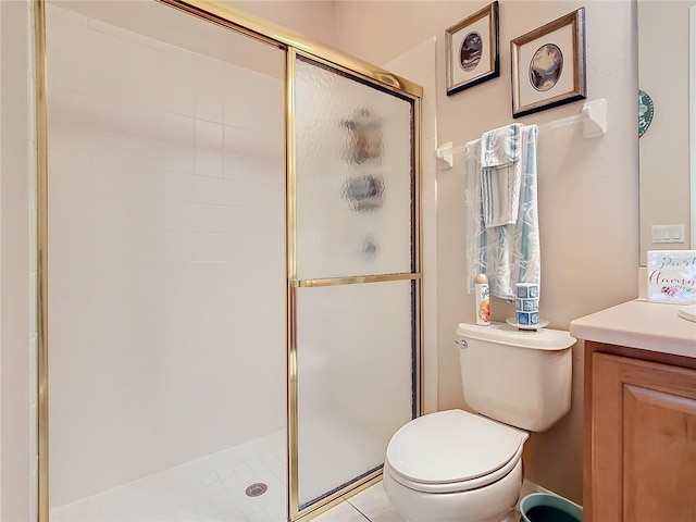 bathroom featuring vanity, walk in shower, toilet, and tile patterned flooring