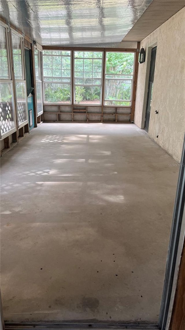 unfurnished sunroom with a wealth of natural light